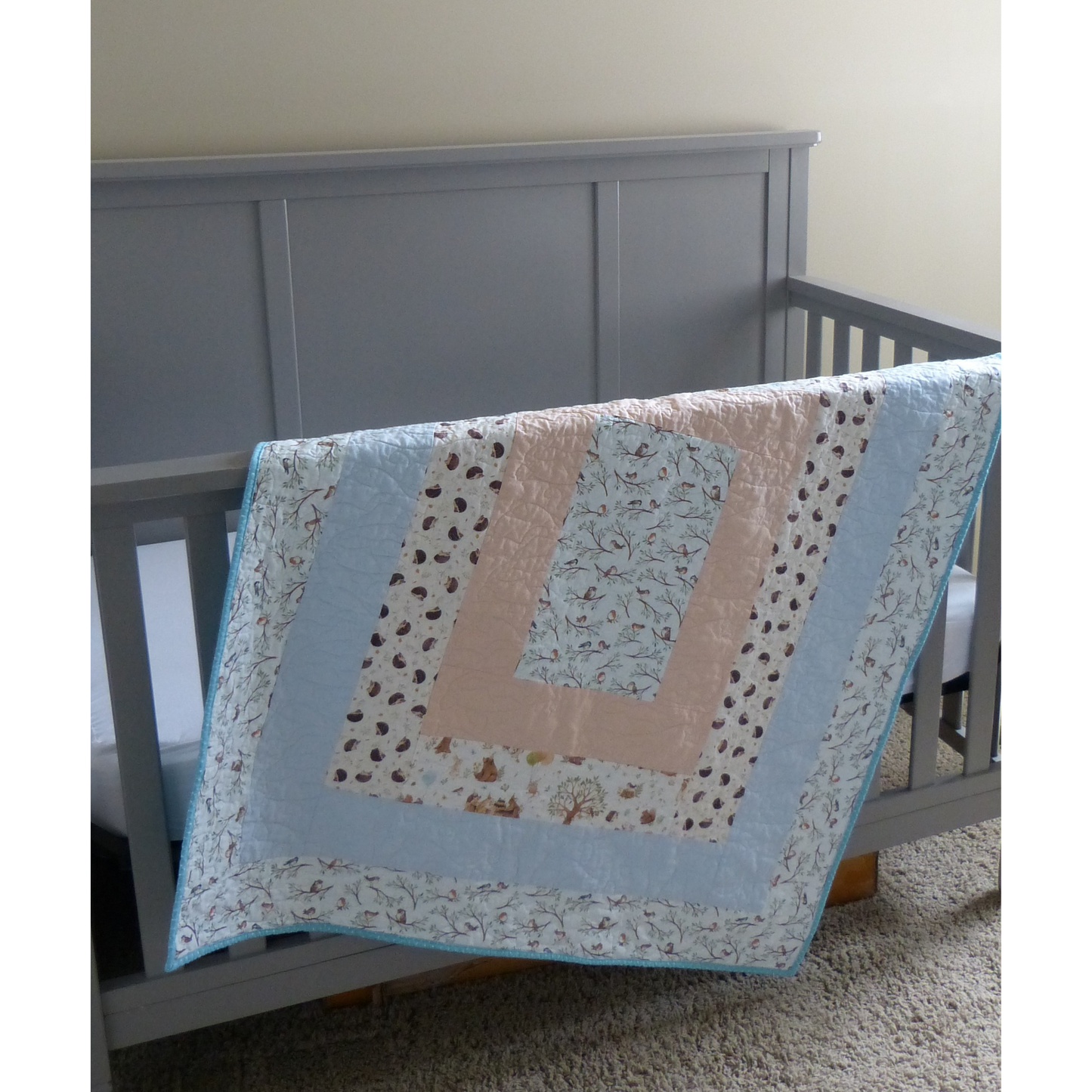 Bird and Hedgehog Baby/Toddler Quilt with Peach and Blue Background and Fireside Backing